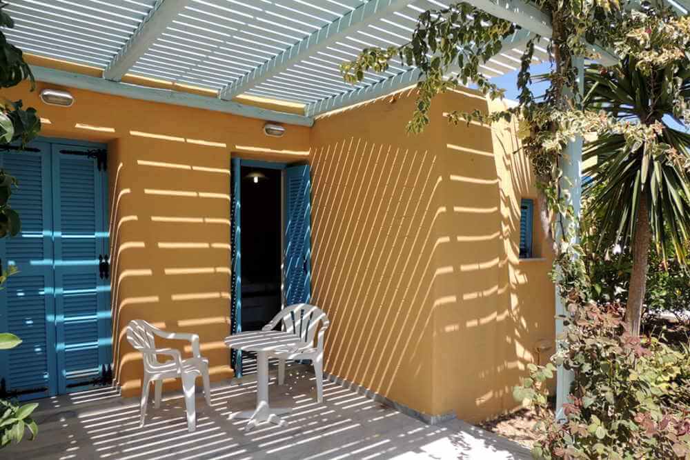 Bungalows surfing beach paros. Organised campsites greece. bungalows greece Camping with rooms by the beach.