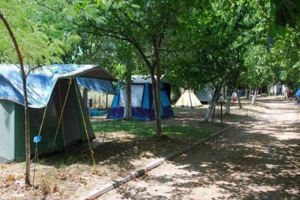 Camping with rooms by the beach. Family vacation in campsite.Camping Aegeas